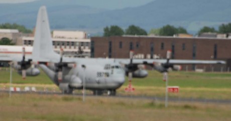 Click on image to see full-sized version US hercules C130 warplane with Irish army escort, Shannon 27June09