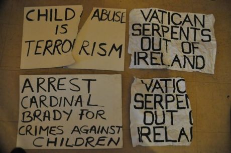 Posters were torn down and strewn acrooss the road outside the cathedral.