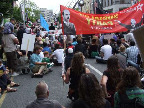 The march sits down on Grand Parade