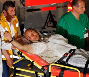 Irish activist Al Mahdi Alharati gestures as he is taken to a hospital in Ankara after arriving in Turkey on a flight from Israel. (times)