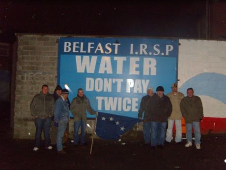 Click on image to see full-sized version IRSP comrades with erected billboard