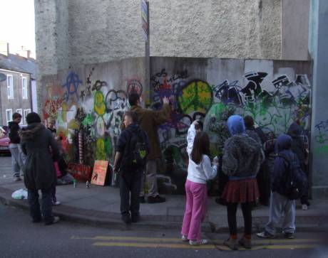 Graffiti painting, Douglas St., early evening