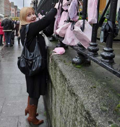 Protester tying shoes to the railings at Pro Cathedral..