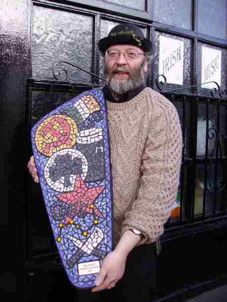 Noel with his Working Class Hero award, outside the Spalpin Fanach pub.