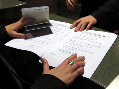 Click on image to see full-sized version Language test being applied at Aer Lingus check-in desk