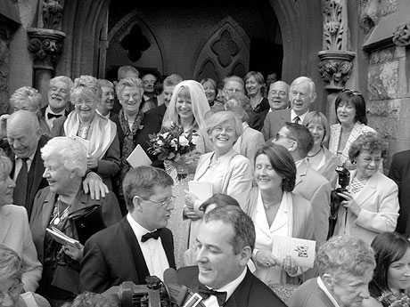 Newlyweds exit into a sea of Black Bloc