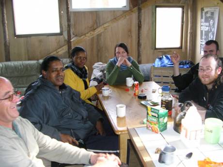 Des and Siziwe drop by the camp for tea.