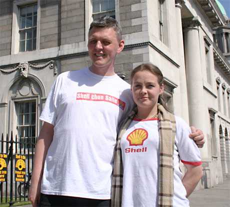 A passerby with a genuine Shell T-Shirt