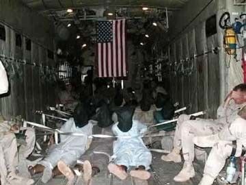 Prisoners en route to Guantanamo for Torture