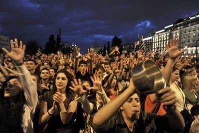 greek protesters trying out the indignant model of things instead of their usual angry stuff.