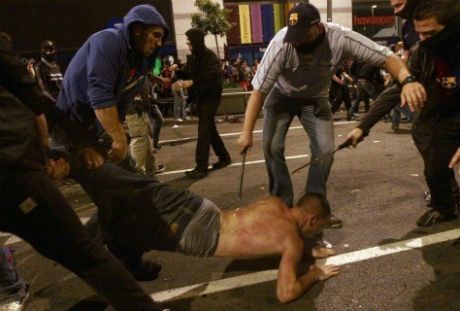 uniformed people (in plain clothes) get retractable baton and sadistic on person (possibly angry)