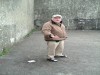 Archbishop Michael Desmond Hynes prepares to serve on the dusty alley in Tullyvin.