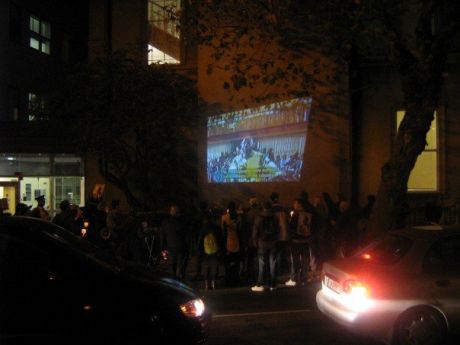 Film projected on to wall of Shell HQ