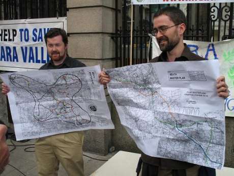 Brian Guckian and Tadhg Crowley outside the Dáil with their plans for the MMP