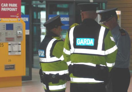 Click on image to see full-sized version Inspector Kennedy, Sgt McMahon leading unduly large force of Gardai at Shannon