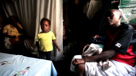 Pauline with her mum and two children in their one room home. They had been forced to flee their home during the post election violence of 2007. (video screengrab)