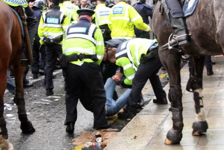 img_2002police_lifting_protestor_from_crowd_at_student_protest.jpg