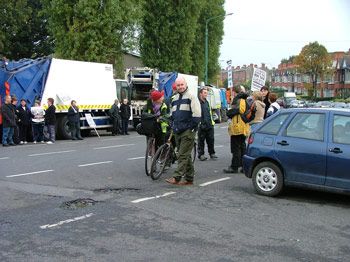 Bin workers return inside while protestors remain on guard