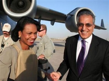 Condi getting off plane & greeted by U.S. ambassador to Iraq Zalmay Khalilzad