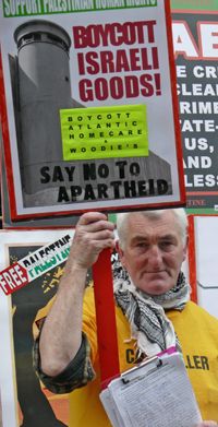 The text on the T-shirt reads, "Caterkiller" : a fact that the spirit of the murdered Rachel Corrie, from her unquiet grave, would not find fault with?