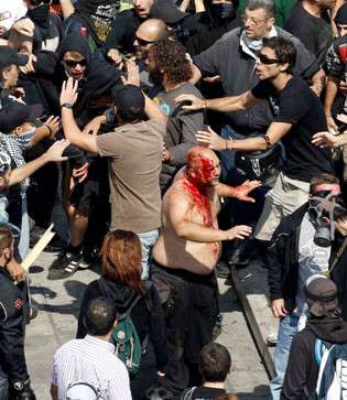 fascist, perhaps cop, attacked by leftists in Athens 