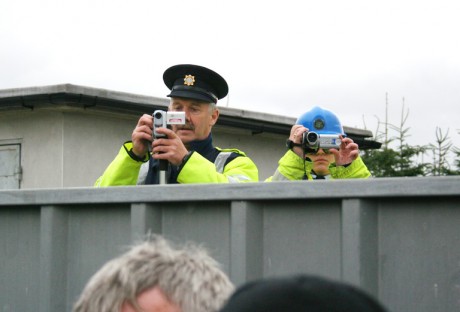 Gardai and Shell security filming over the gates