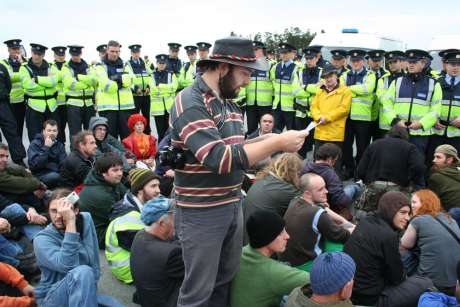 John Monaghan reads a message of support from Nuremburg Shell to Sea (Germany)