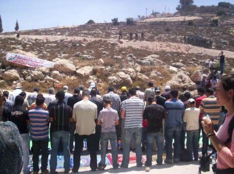 Palestininians pray before demonstration against the Annexation Wall
