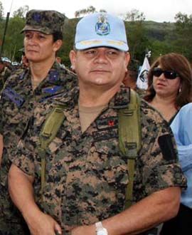 Romero Vazquez graduated from the School of the Americas & so has got their cap. & you thought it was a UN blue helmet, didn't you?