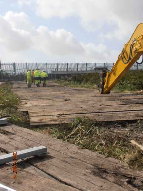 The workers and digger drivers walking away from the protesters