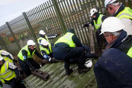 people being forcably removed from fence panels