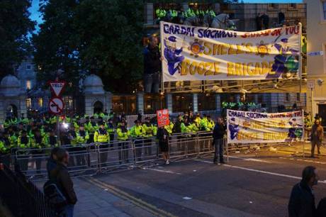 Garda protecting the Dail with large banner reminding everyone of the Shell Booze Bribes of the Cops in Mayo